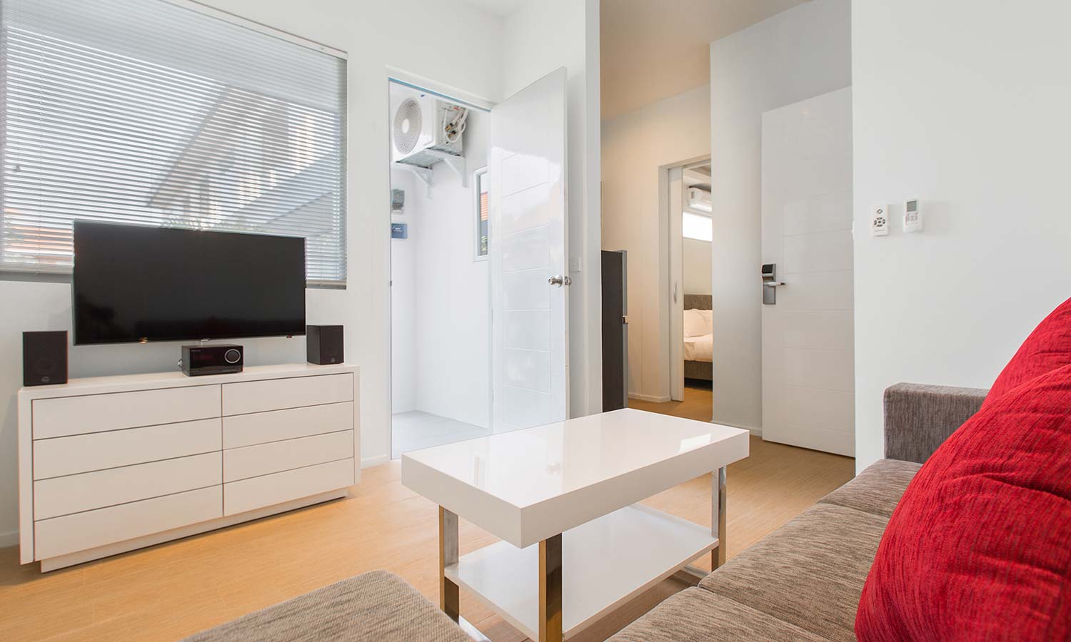Apartment Deluxe Our Deluxe apartment features a spacious 56 m2 - 63 m2 square-meters of modern living, complete with all the comforts and amenities needed to make your stay a memorable one. Featuring a separate living and dining space, flat screen TV, DVD player and sound system and a well-appointed kitchen. Our spacious bedrooms feature King-size beds, his and her wardrobes and en suit showers. All of our apartments are serviced daily by our house keeping team.