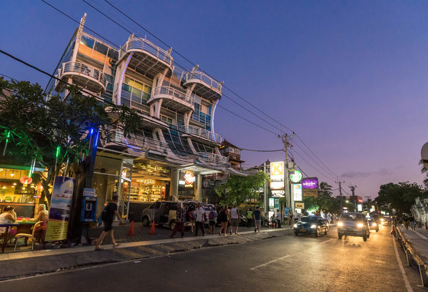 Walk along Kuta  Street  Coast Boutique Apartments